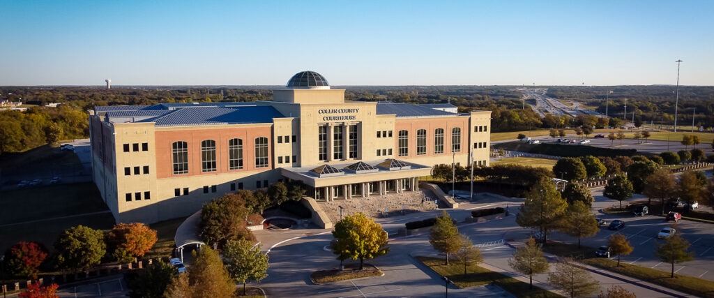 Aerial photo of Collin County Courthouse located in county seat of McKinney TX, where criminal law, family law, and other legal matters are heard. For a McKinney DWI lawyer near me.